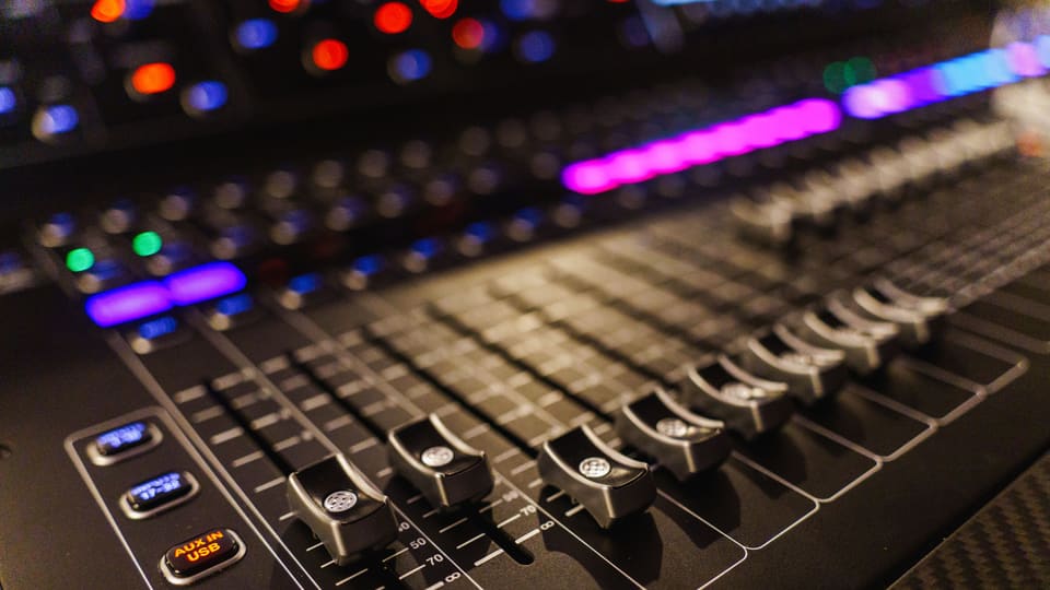 Detailed view of an advanced audio mixing console, perfect for studios.
